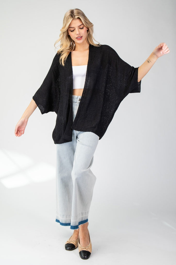 Kimono Style slouchy cardigan with short dolman sleeves made in knit fabric that's as comfy as your favorite pajamas, but way more stylish! This versatile piece drapes beautifully over any outfit, adding that perfect touch of a classic look and fit for any occasion. model wearing black with short jeans and flats