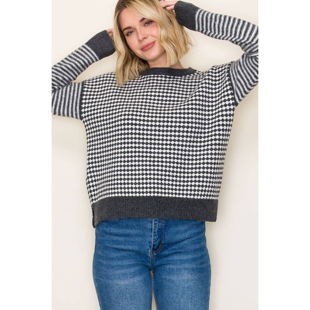 White and gray in color.  CREW NECK, LONG STRIPED SLEEVE, CHECKERBOARD, PULLOVER SWEATER