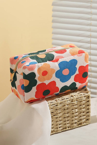 colorful bold floral pattern cosmetic bag with a zipper gold in color