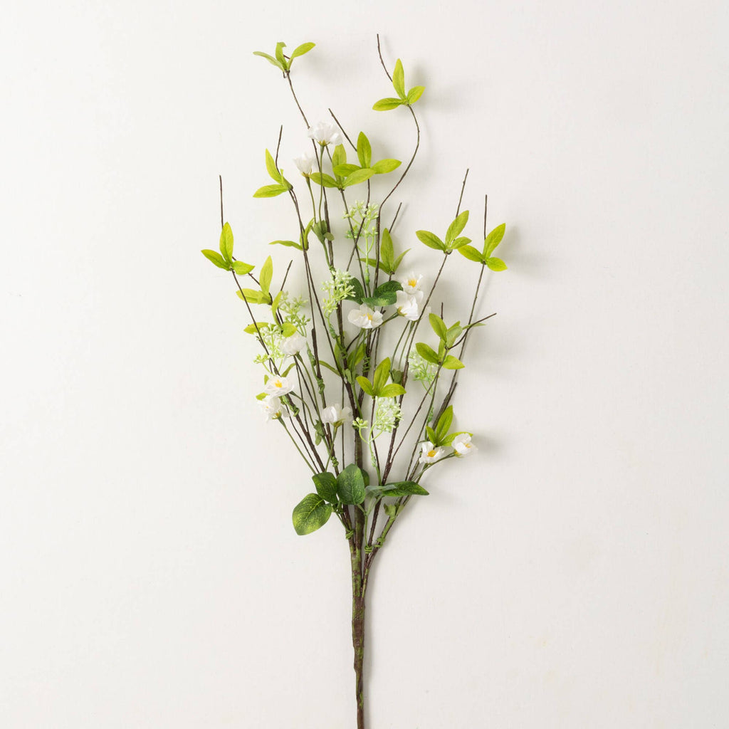 this spray is lush spring green leaves with a dappling of white flowers