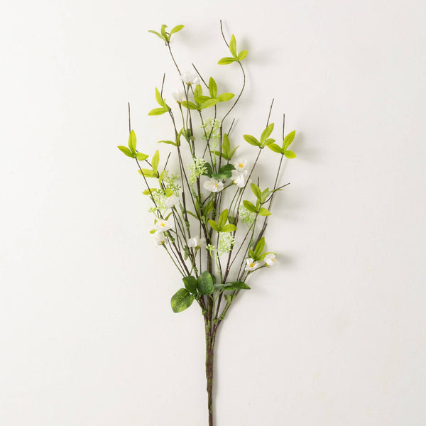 this spray is lush spring green leaves with a dappling of white flowers