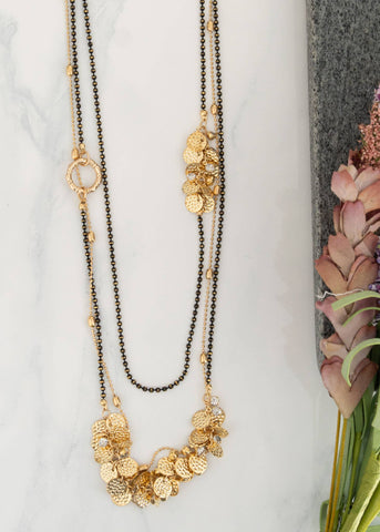 This 3-strand nickel free hypo allergenic Tati necklace has golden discs embellishments