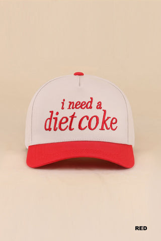 playful baseball style cap in red that says "i need a diet coke" red bill and tan cap
