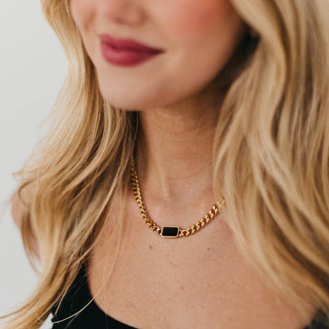 Our Black Stone Chain Necklace features a thick, gold, adjustable, chain with a black statement stone attached. 16-18 inches