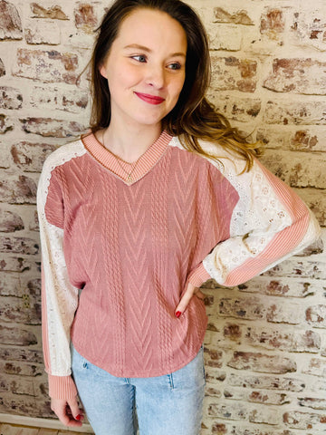 mauve v neck sweater with white shoulders and sleeves.   v neck style.