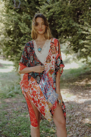Elevate your spring and summer style with our Boho Floral Patchwork Kimono. Embrace the season's vibes with vibrant floral patterns and breezy patchwork design. Perfect for layering over your favorite outfit, whether you're heading to the beach or a festival. Light, airy, and effortlessly chic, this kimono is a must-have addition to your warm-weather wardrobe.