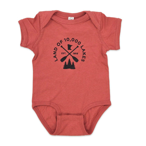 unisex red child onesie with screen print of "land of 10,000 lakes"