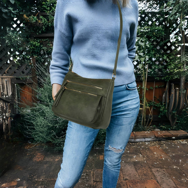 Multi-pocket crossbody vegan friendly bag with an adjustable strap.  
