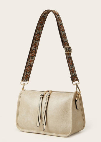 bohemian cross body bag with semi floral Victorian design and a double zipper from both sides of bag. light creamy tan color