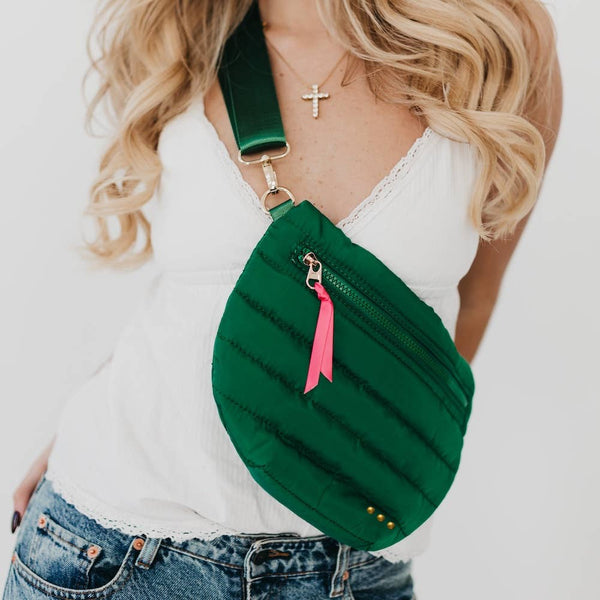  A trendy take on the updated fanny pack that can be worn in multiple ways. Wear it as a belt bag/fanny pack, crossbody, or shoulder bag. Features a fun half moon shape with a coordinating shiny canvas strap and gold hardware and a pop of color with ribbon accent.

 