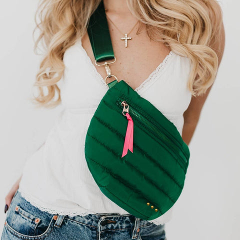 A trendy take on the updated fanny pack that can be worn in multiple ways. Wear it as a belt bag/fanny pack, crossbody, or shoulder bag. Features a fun half moon shape with a coordinating shiny canvas strap and gold hardware and a pop of color with ribbon accent.

 