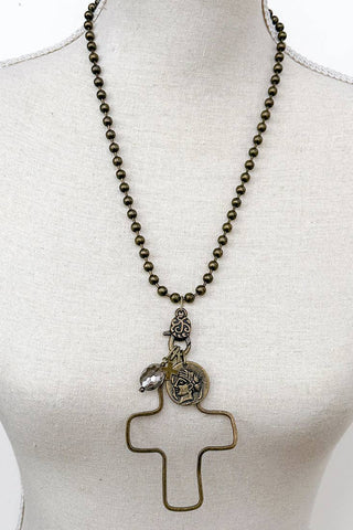  This necklace features a wire cross pendant that dangles elegantly from a finely crafted chain. The pendant is of a cross adorned with 2 small charms